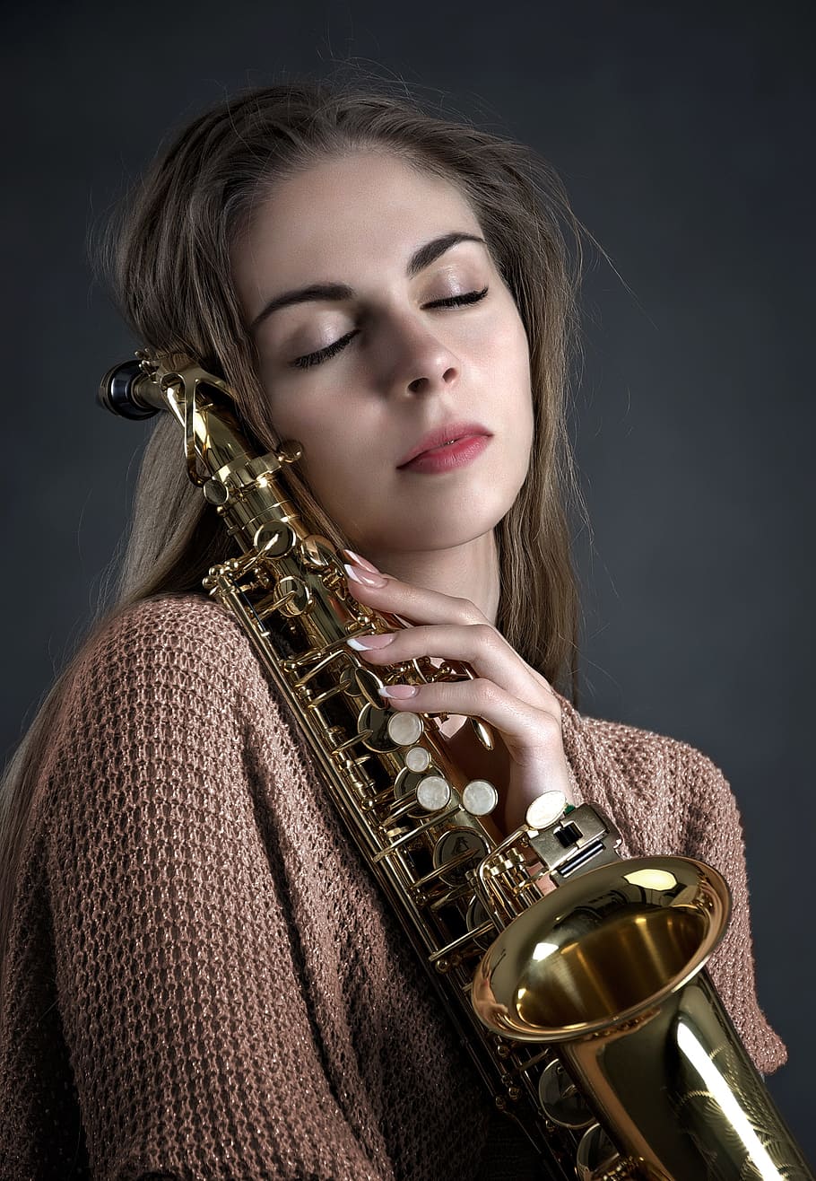 woman holding brass-colored saxophone, girl, music, instrument, HD wallpaper