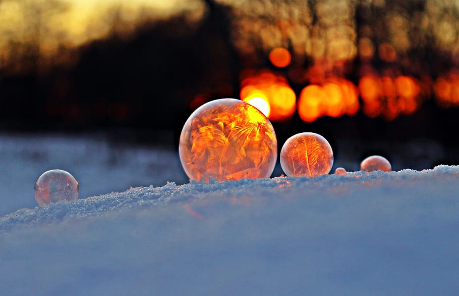 selective focus photography of three balls on white surface HD wallpaper