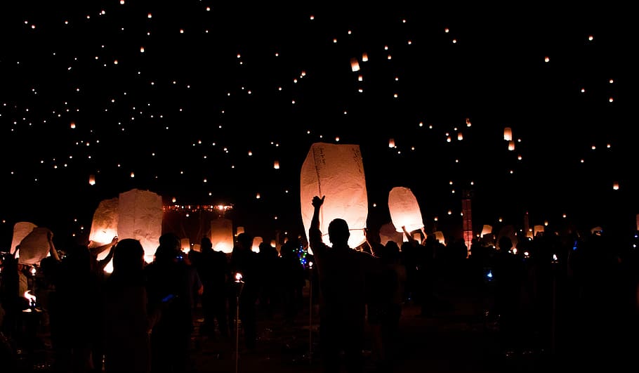 group of people holding lanterns, silhouette of people under floating lanterns HD wallpaper