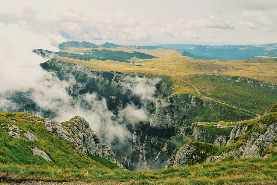 green mountain hill during daytime, landscape photography of mountain with mist HD wallpaper