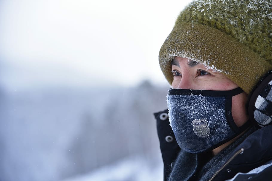 woman wearing green knit cap and blue mask, man in blue face mask HD wallpaper
