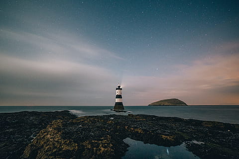 black and white concrete lighthouse on body of water photo during daytime, white and black light house near body of water HD wallpaper