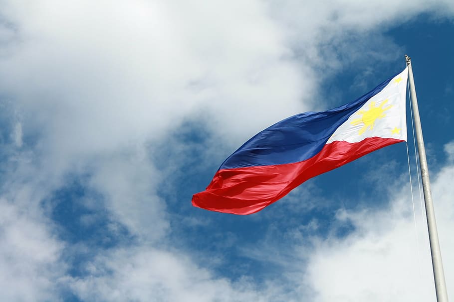 close-up photo of The Republic of Philippines flag at daytime