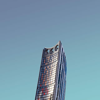 low-angle photography of gray concrete building under clear sky HD wallpaper