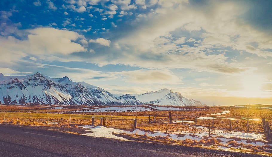 brown field near glacier mountain at daytime, mountains, sky HD wallpaper