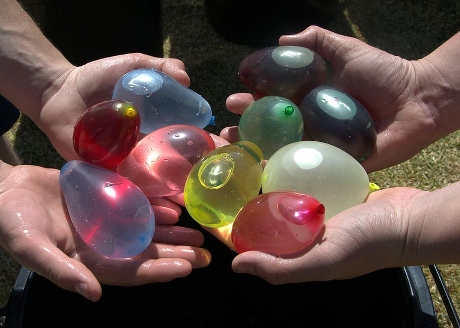 Water Balloons, Colourful, comparing, human hand, human body part HD wallpaper