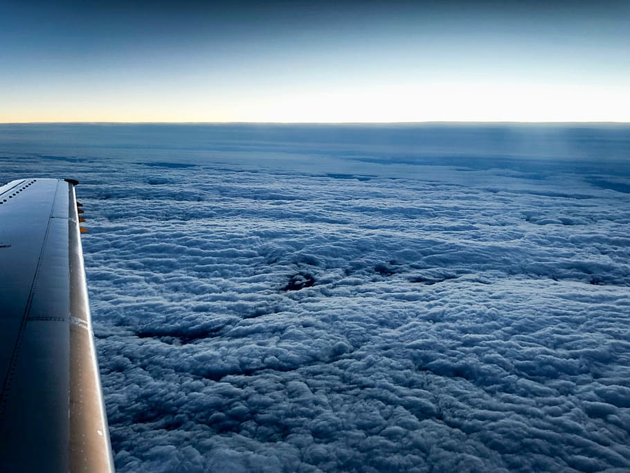 photo of airplane up in the sky, gray airplane displaying clouds HD wallpaper