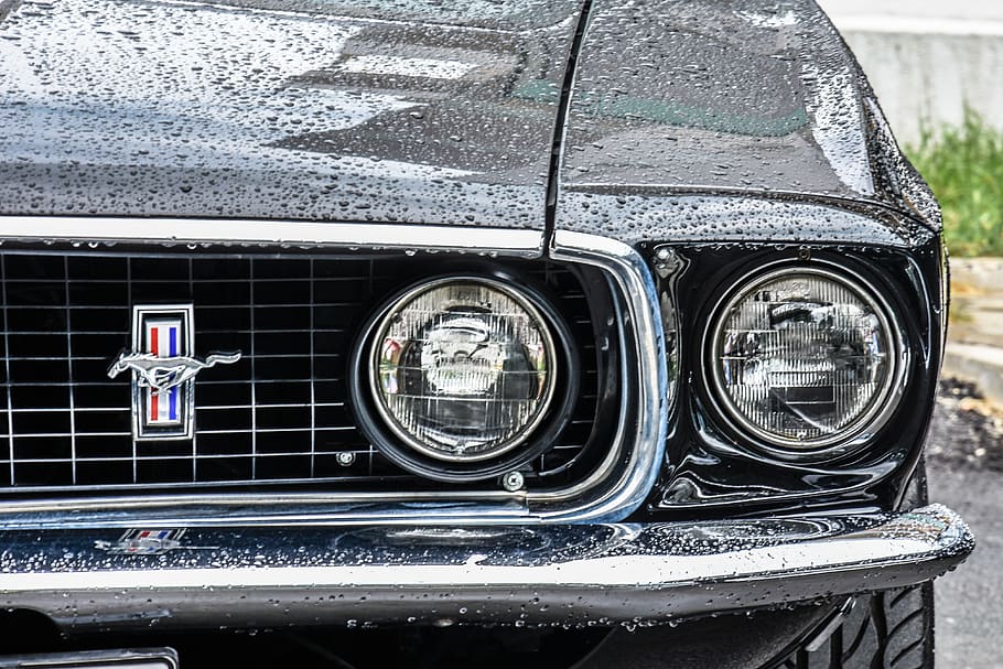 close-up photo of classic black Ford Mustang coupe at daytime