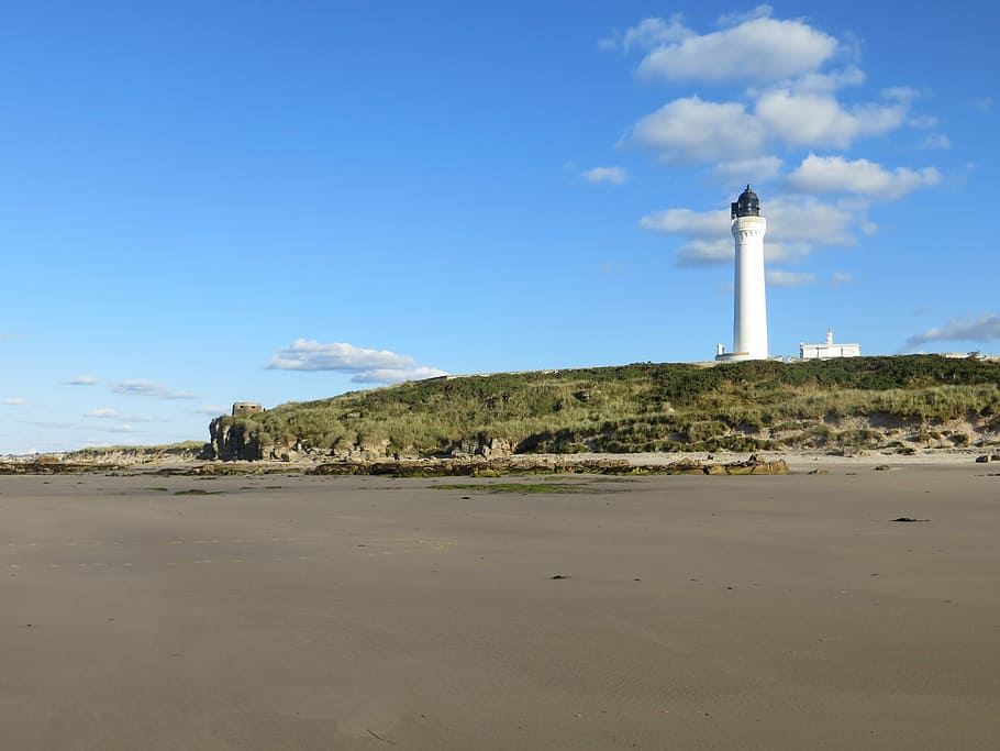 lighthouse, beach, scenic, coastline, sky, shore, clouds, coastal HD wallpaper