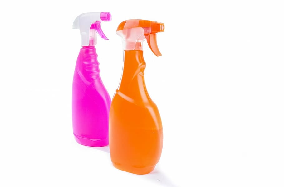 two pink and orange plastic sprayer bottles, household, surface