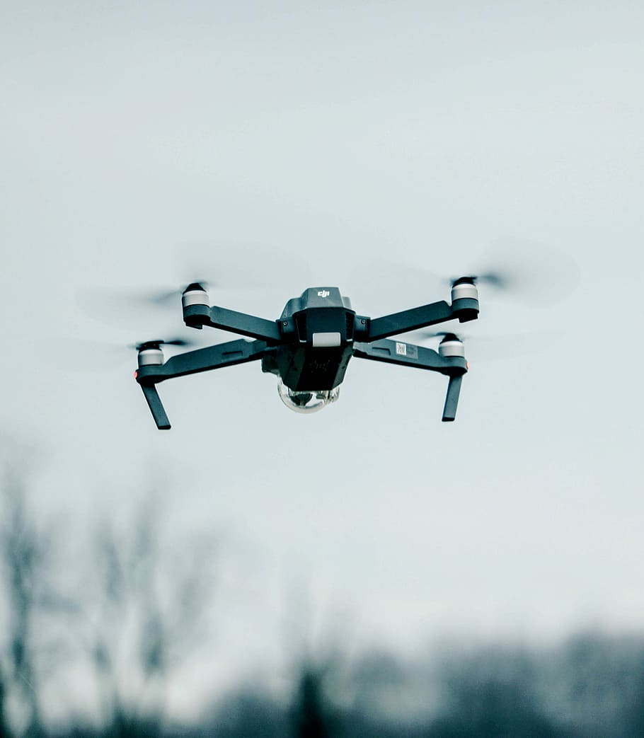 selective focus photography of flying quadcopter, black quadcopter drone HD wallpaper