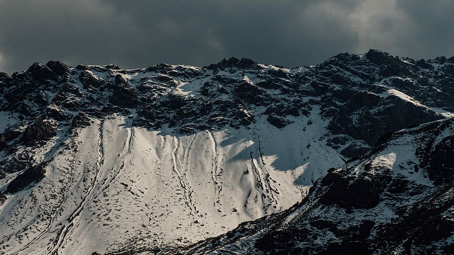 black mountain filled with snow during daytime, landscape photography of snow-covered mountain HD wallpaper
