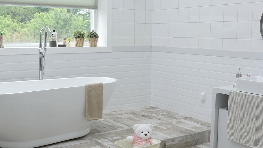 white ceramic tub with stainless steel faucet during day time HD wallpaper