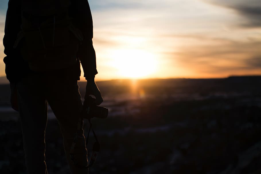 person holding camera, people, man, sunset, sunlight, photographer HD wallpaper