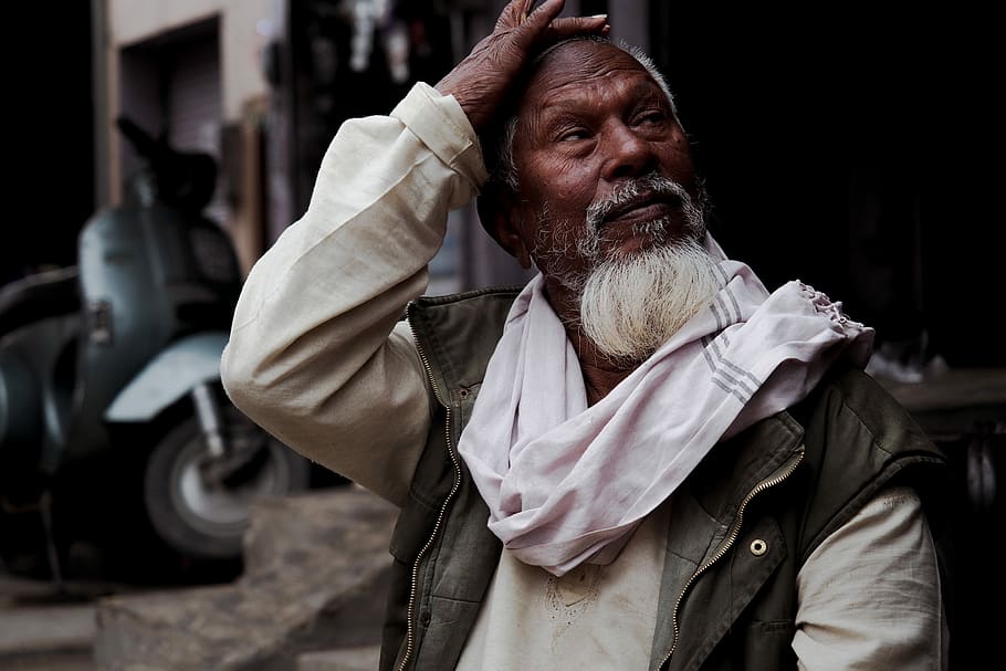 man with white scarf touching his forehead, man in white and black jacket HD wallpaper