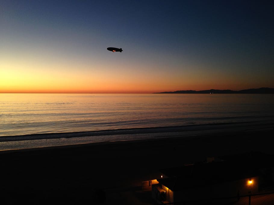 airship, blimp, sunset, beach, peaceful, sea, sky, water, flying