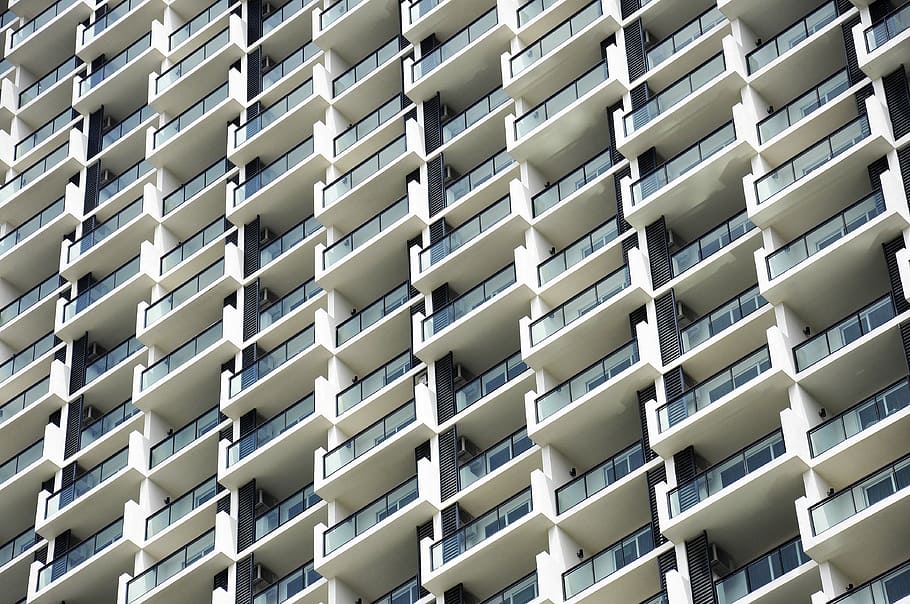 low-angle photo of white concrete building, high-rise building at daytime HD wallpaper