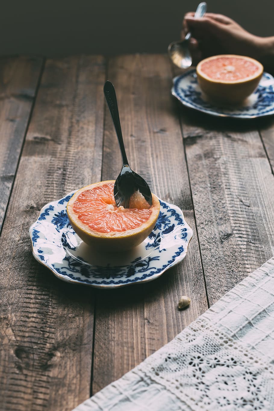 teaspoon dip into citrus fruit, grapefruit on saucer with spoon HD wallpaper