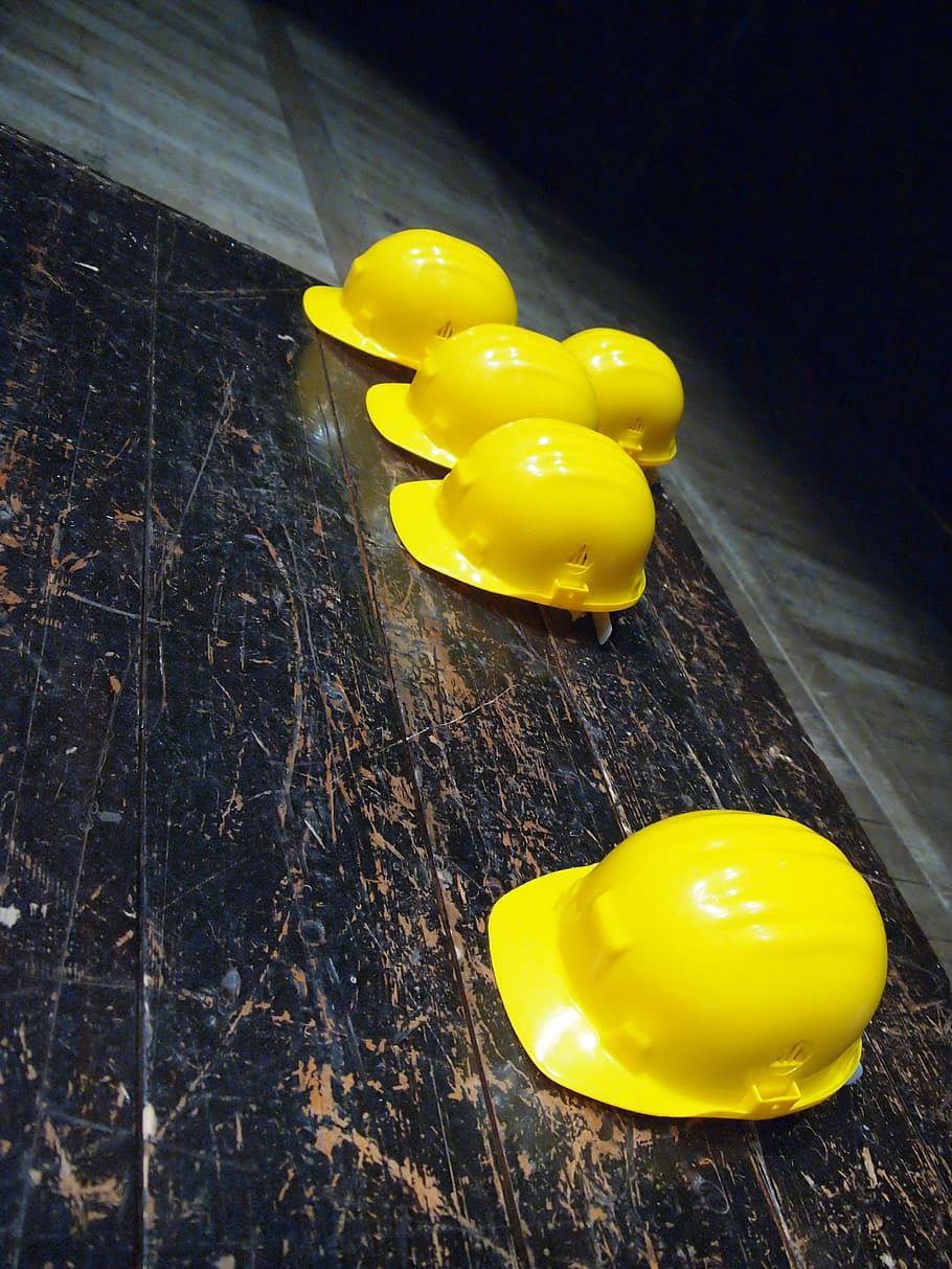 five yellow hard hats on gray surface, five yellow hard helmets HD wallpaper
