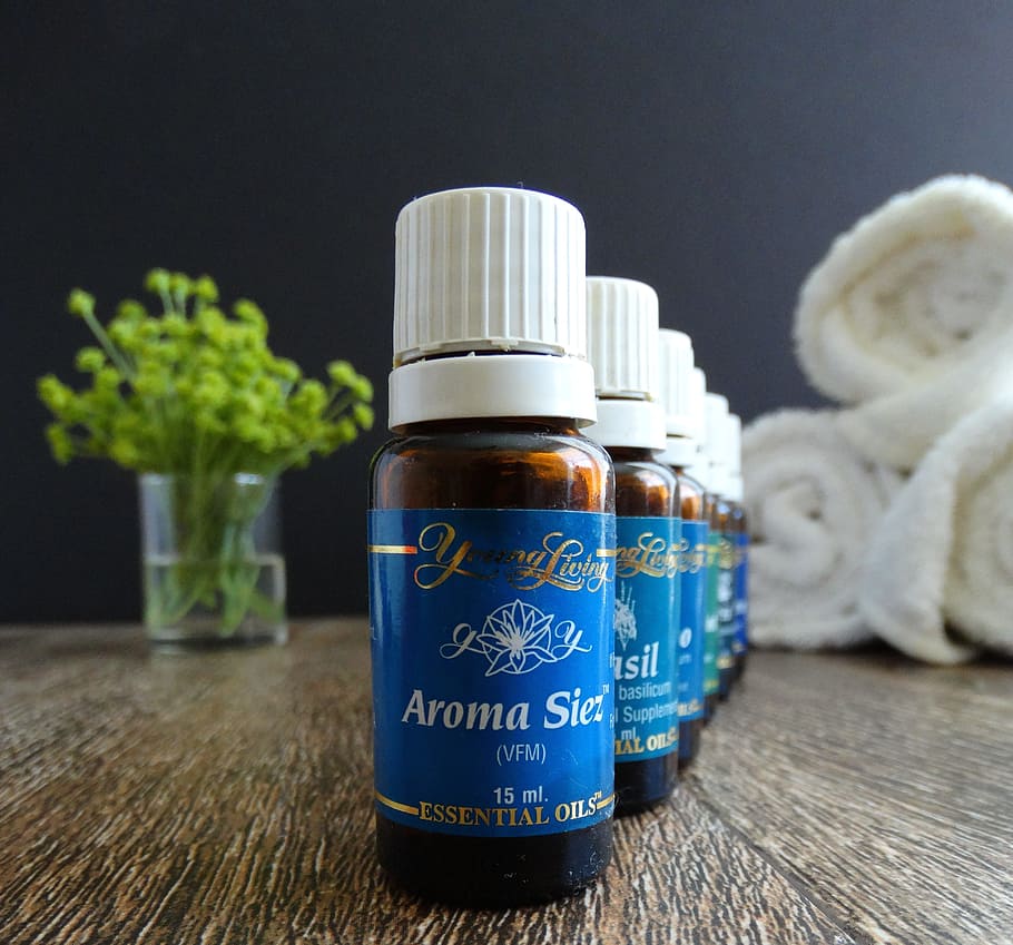 Aroma Siez oil bottles near white towels, essential oils, wellness HD wallpaper