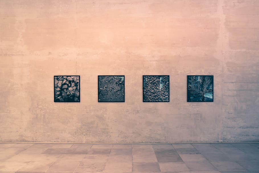 four black wall arts on brown wall, four black wall decors, building HD wallpaper