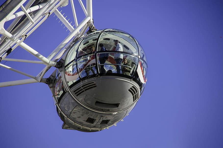 people inside white ferris wheel pod, low angle photography of hanging dinner area HD wallpaper