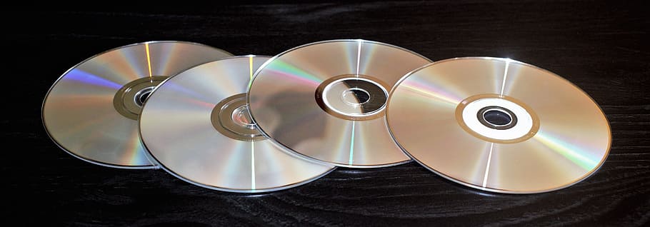four compact discs, cd, dvd, software, digital, cd-rom, dvd-rom