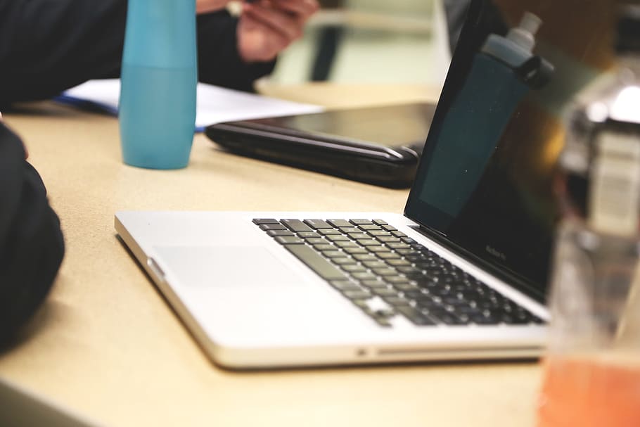 MacBook Pro on brown table, startup, start-up, notebooks, creative HD wallpaper