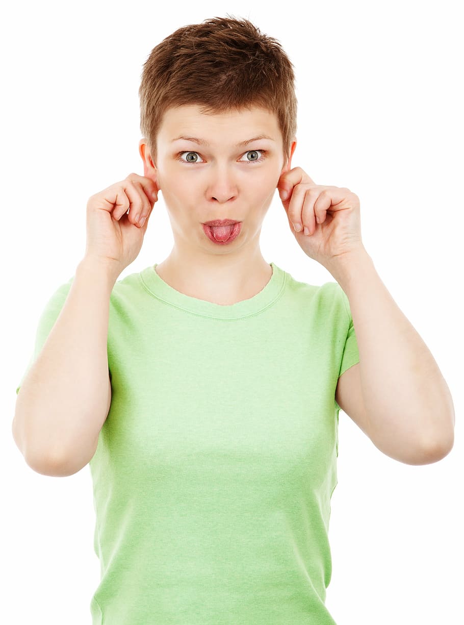 woman holding both hear ears and sticking her tongue out, adult HD wallpaper
