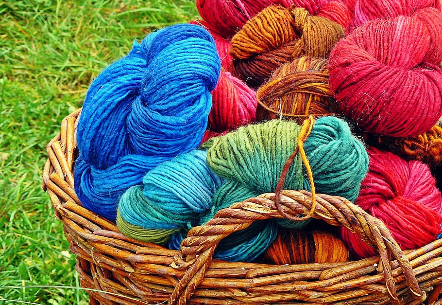 assorted-colored yarns in basket, wool, knitting wool, cat's cradle