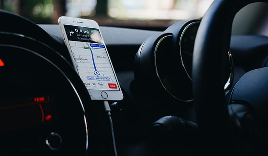 iPhone on vehicle phone holder, silver iPhone using GPS application HD wallpaper