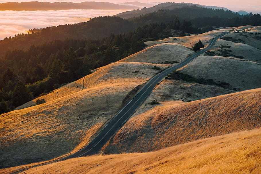 aerial view of mountain with asphalt road, aerial photography of brown grass field HD wallpaper