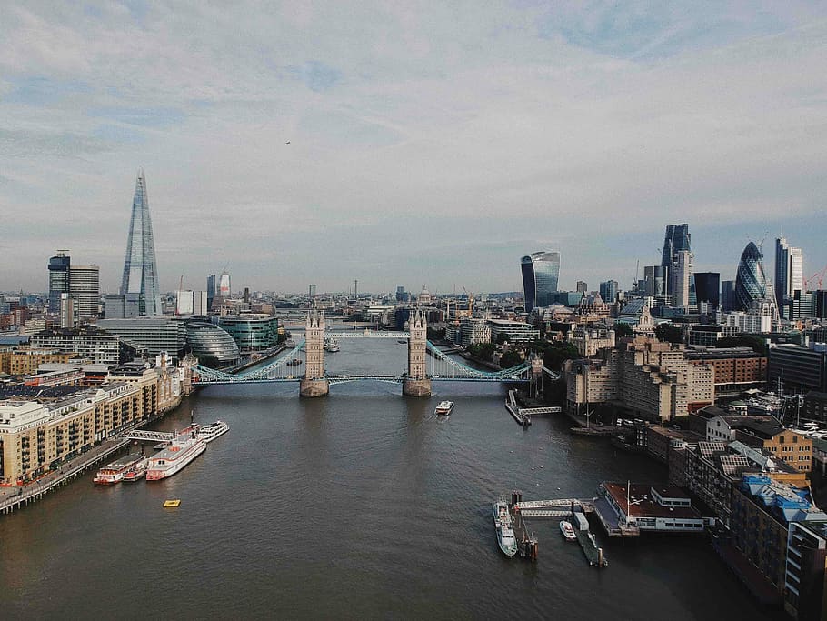 gray bridge in between of buildings, aerial photography of tower bridge, London during daytime HD wallpaper