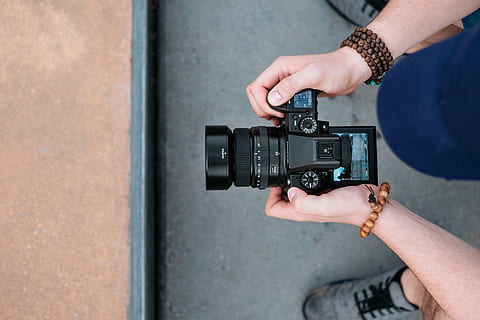 Fujifilm GFX50S medium format camera, person holding camera, dial HD wallpaper