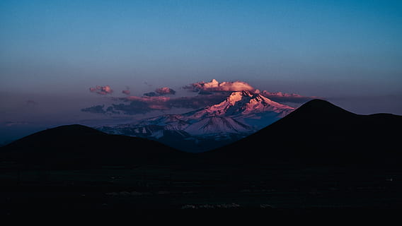aerial photo of mountains during daytime, silhouette mountain photo during night time HD wallpaper