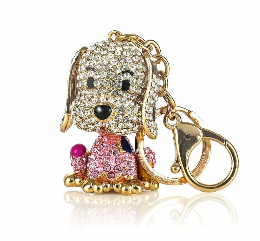 gold-colored clear and pink gemstone dog keychain, key ring HD wallpaper