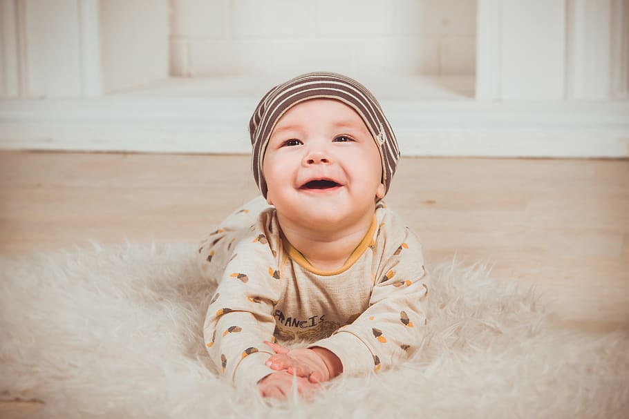 baby in brown onesie, babe, smile, newborn, small child, slider, HD wallpaper