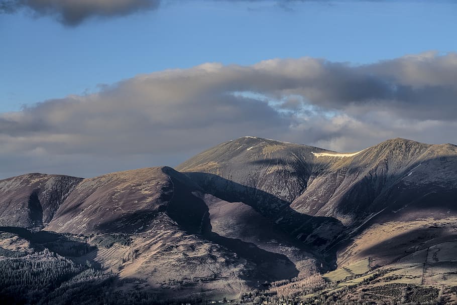 gray mountain during daytime, landscape photography of brown mountain under gray sky HD wallpaper