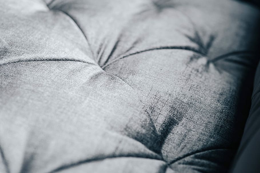 Close-ups of pillows and a grey sofa, bed, couch, material, settee