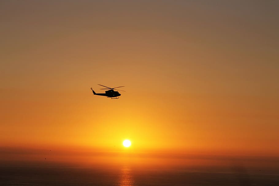 helicopter, sun, sunset, flying, nature, sky, orange color HD wallpaper