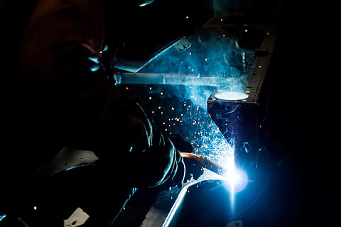 Online crop | HD wallpaper: man doing welding holding red welding mask ...