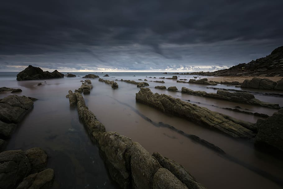 rock formation on body of water, stone formation on seashore HD wallpaper