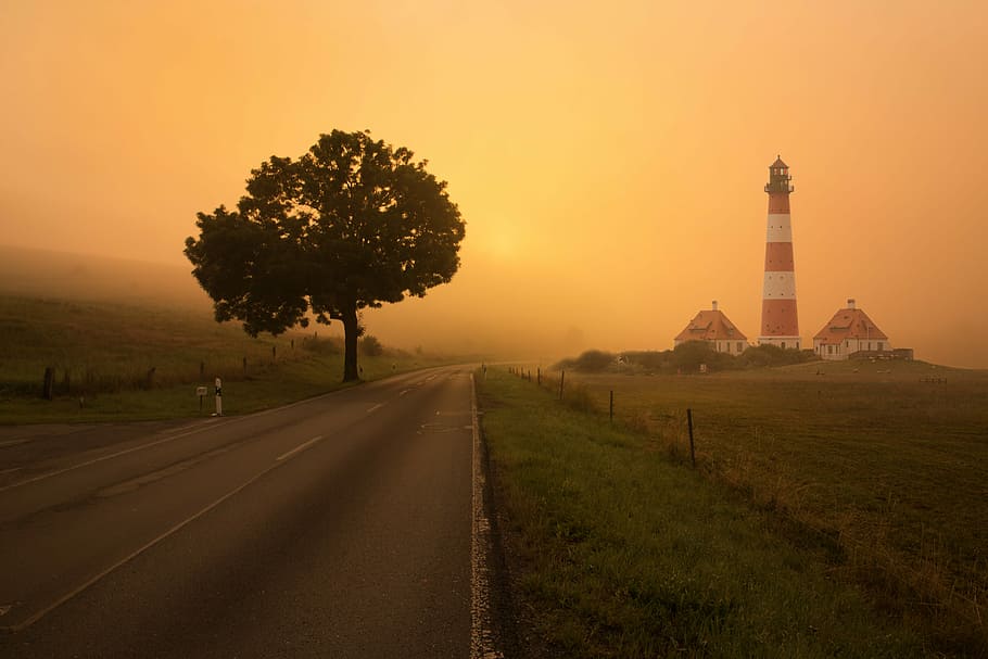 empty roadway with lighthouse and two houses, white and red lighthouse beside two houses HD wallpaper