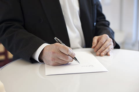 man holding gray twist pen writing on white printer paper, contract HD wallpaper