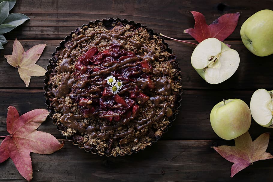 baked pastry on brown wooden surface beside sliced apples, cooked dish HD wallpaper