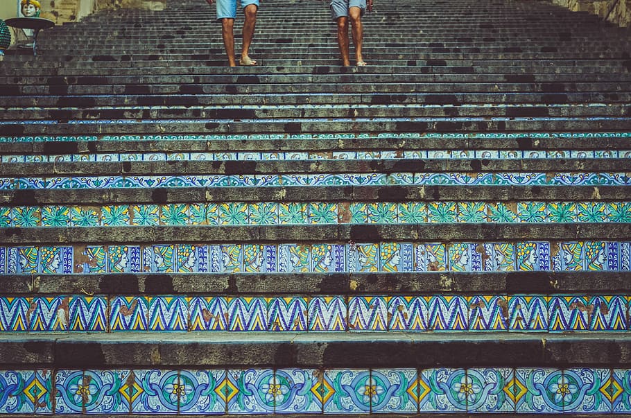 two person's stepping on stairs, two person walking downwards on green and black staircase HD wallpaper