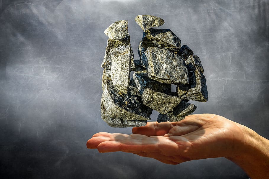 person's hand with rock floating over illustration, stone, explosion HD wallpaper