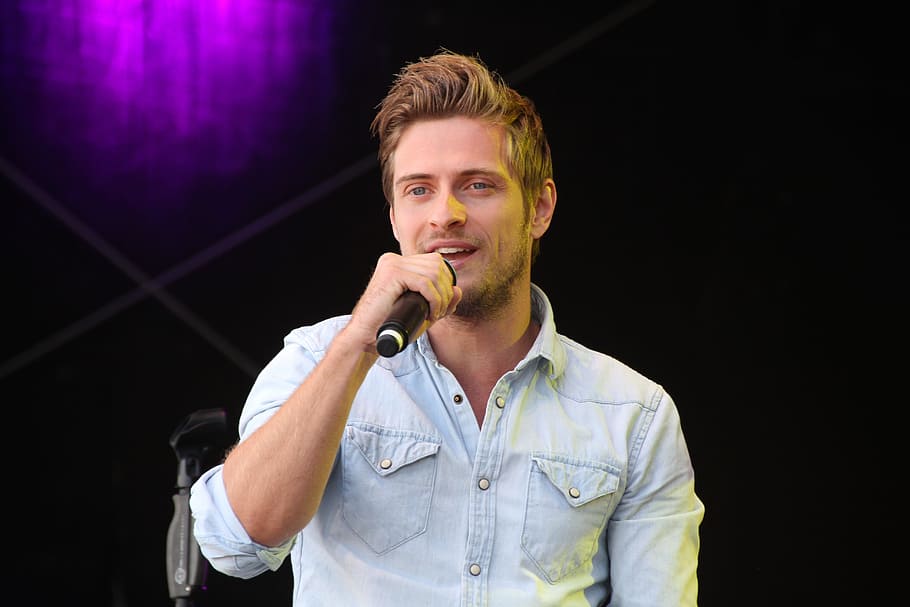 Portrait of Young Man Holding Camera, fine-looking, microphone HD wallpaper