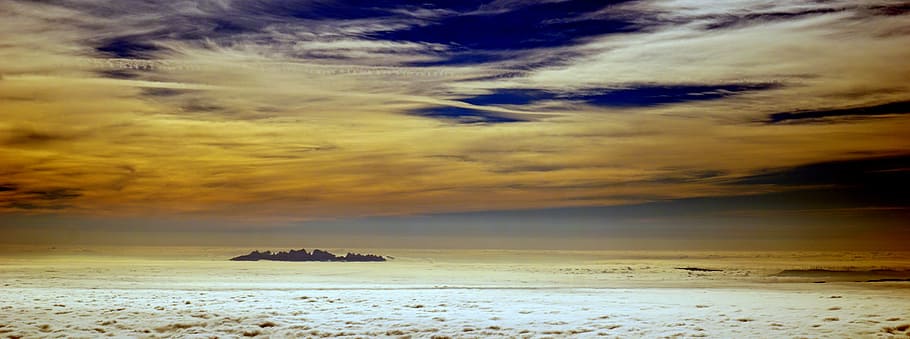 landscape photography of gray field under blue and gray sky HD wallpaper