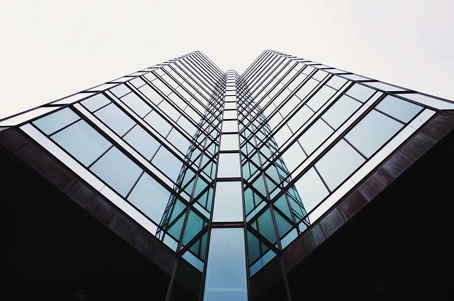 clear glass building reflection itself in clear glass window HD wallpaper